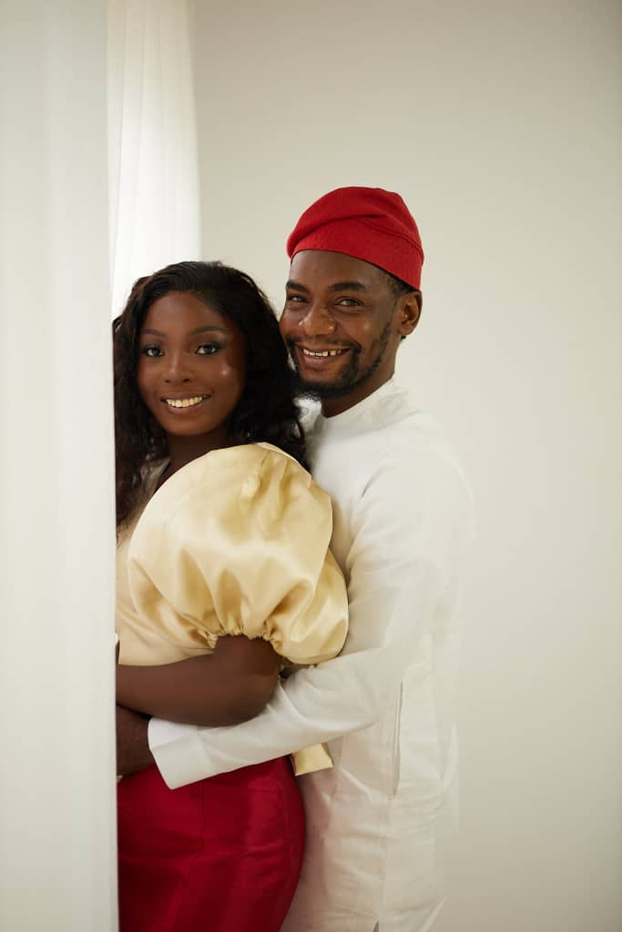 Opeyemi and Chima embracing and smiling